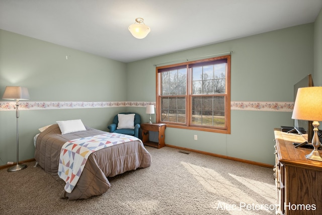 bedroom with baseboards, visible vents, and carpet floors