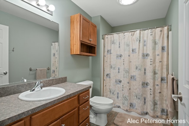 full bath with tile patterned floors, a shower with shower curtain, toilet, and vanity