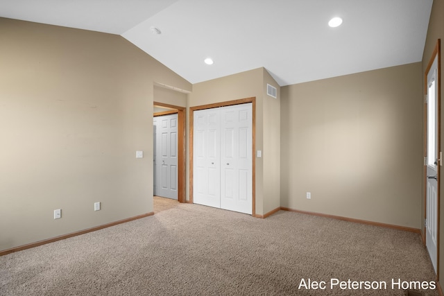 unfurnished bedroom featuring visible vents, baseboards, lofted ceiling, light carpet, and recessed lighting