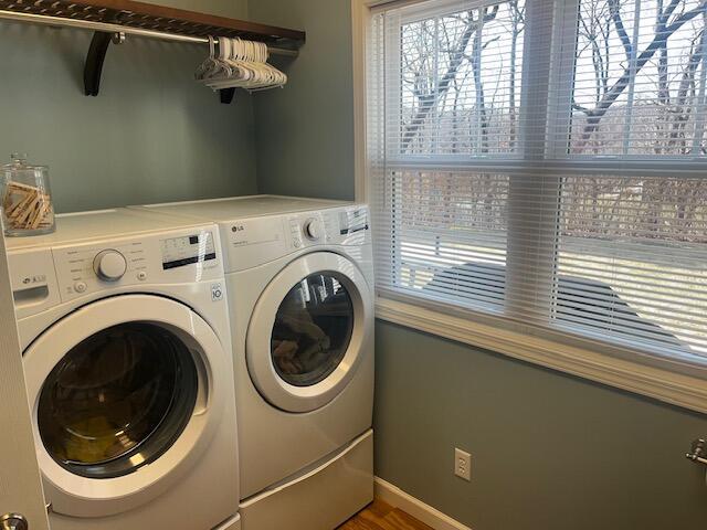 washroom featuring laundry area and washer and clothes dryer