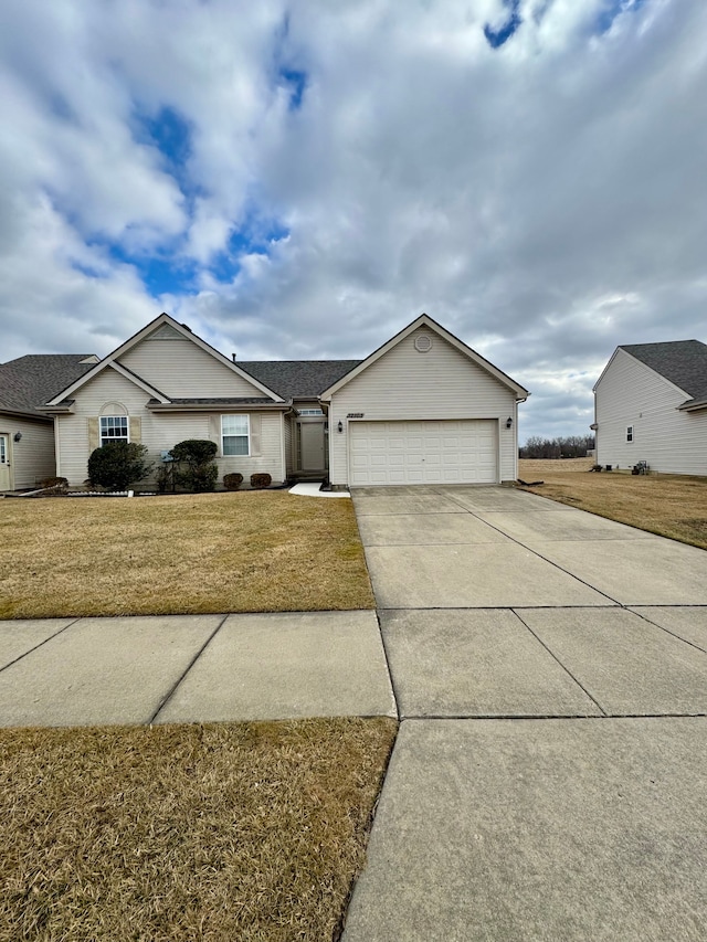 ranch-style home with driveway, an attached garage, and a front yard