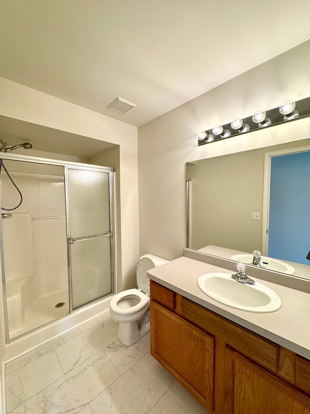 full bathroom with visible vents, toilet, a stall shower, marble finish floor, and vanity