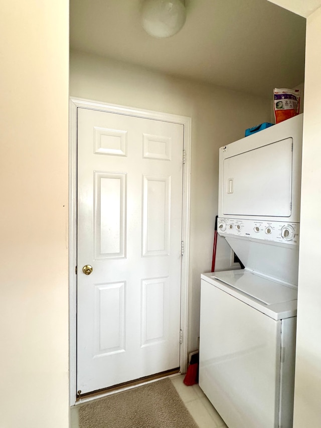 laundry room with laundry area and stacked washer and dryer