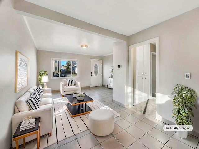 living area featuring baseboards and light tile patterned flooring