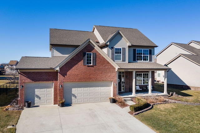 traditional-style house with brick siding, covered porch, and concrete driveway