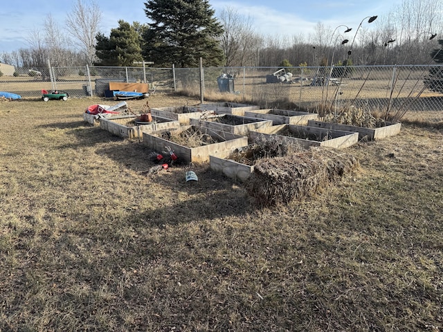 view of yard featuring a vegetable garden and fence