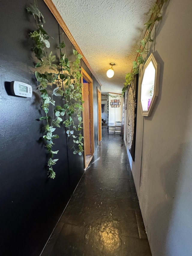 hallway featuring a textured ceiling