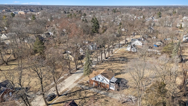 drone / aerial view with a wooded view