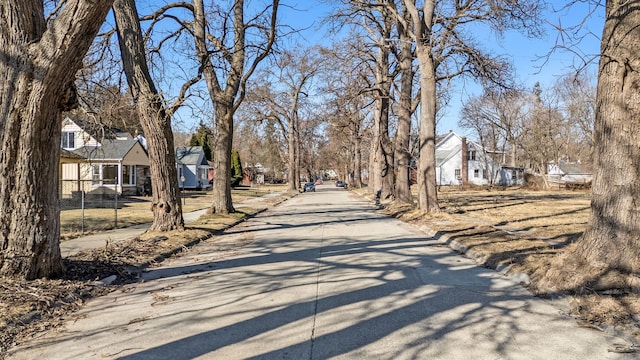 view of street with curbs and a residential view