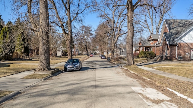 view of road featuring a residential view, curbs, and sidewalks