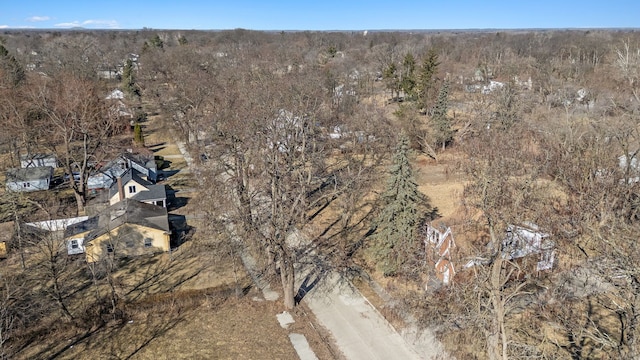 drone / aerial view featuring a forest view