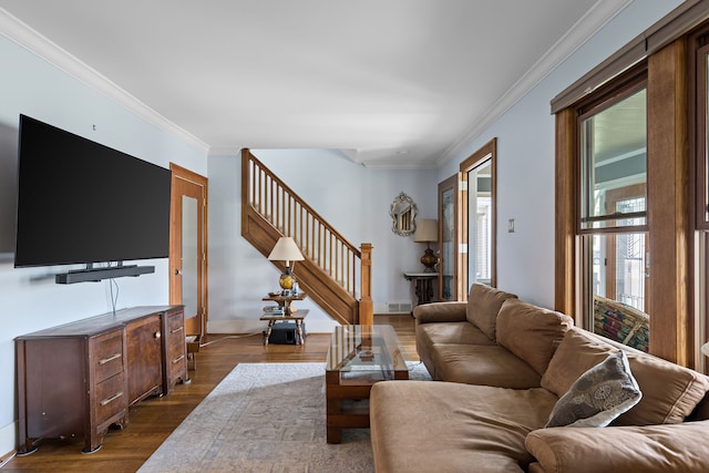 living area featuring stairway, baseboards, dark wood finished floors, and crown molding