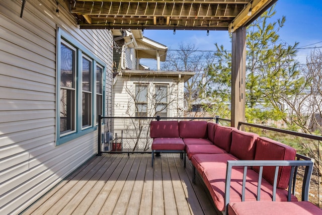 wooden deck with outdoor lounge area