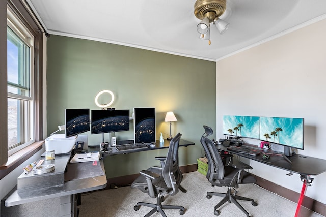 home office featuring baseboards, carpet, ornamental molding, and a ceiling fan