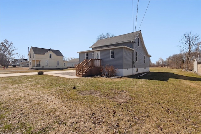 back of property featuring a yard