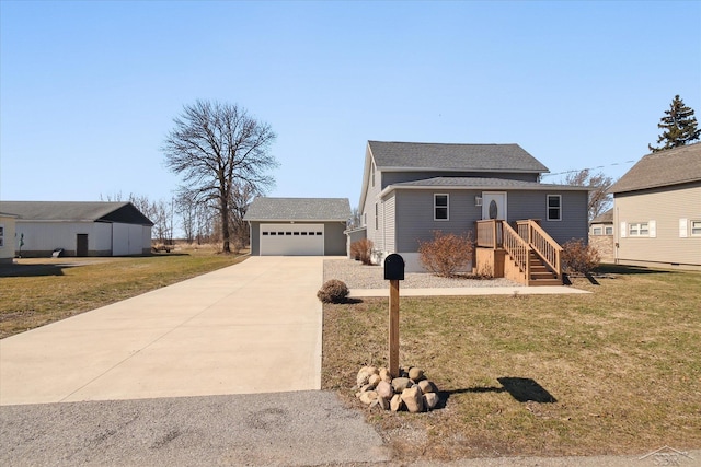 view of front facade with a front yard, a garage, and an outdoor structure