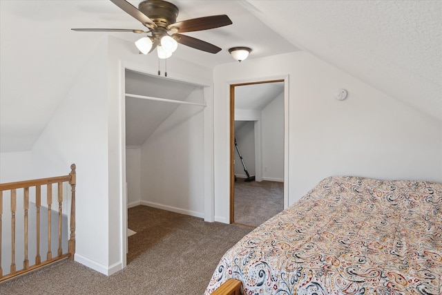 carpeted bedroom with vaulted ceiling, a ceiling fan, and baseboards