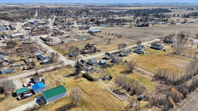 birds eye view of property with a rural view