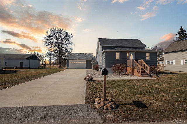 view of front of home with a garage, driveway, and a front yard