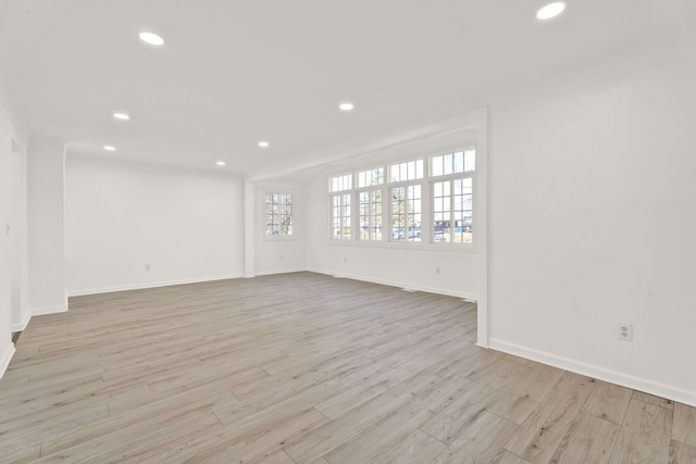 unfurnished room featuring recessed lighting, baseboards, and wood finished floors