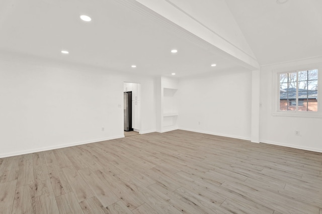 interior space featuring lofted ceiling, recessed lighting, baseboards, and light wood finished floors