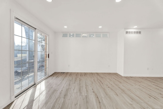 spare room with recessed lighting, visible vents, baseboards, and light wood-style floors