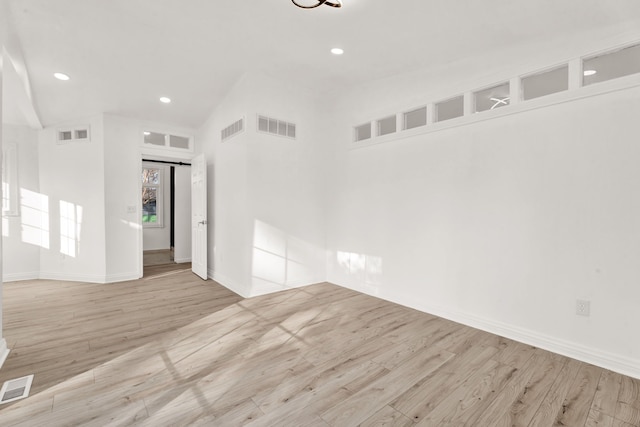 empty room with visible vents and wood finished floors