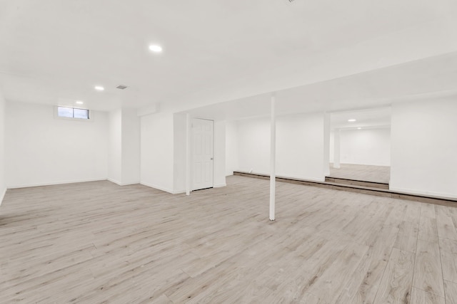 basement featuring recessed lighting and wood finished floors