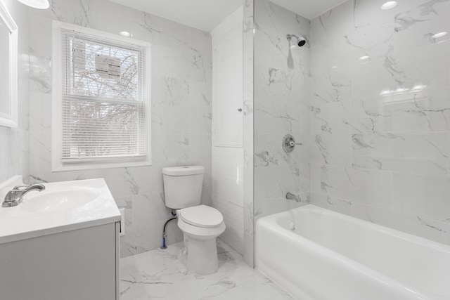 bathroom with vanity, toilet, marble finish floor, and shower / bathtub combination