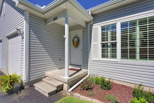 property entrance with an attached garage