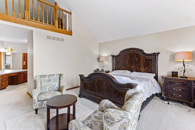 bedroom featuring high vaulted ceiling, baseboards, visible vents, and light carpet