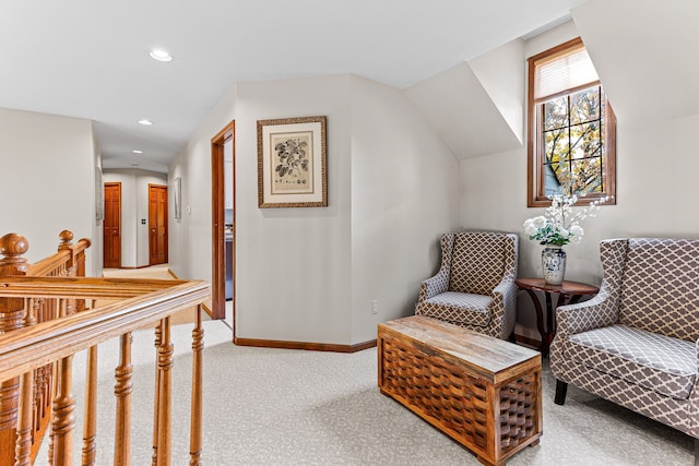 sitting room with baseboards, lofted ceiling, carpet floors, an upstairs landing, and recessed lighting