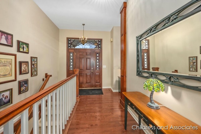 entrance foyer featuring baseboards and wood finished floors