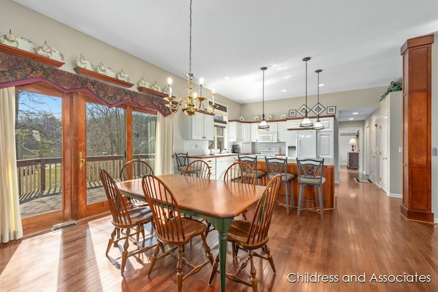 dining room with visible vents, baseboards, and dark wood-style flooring