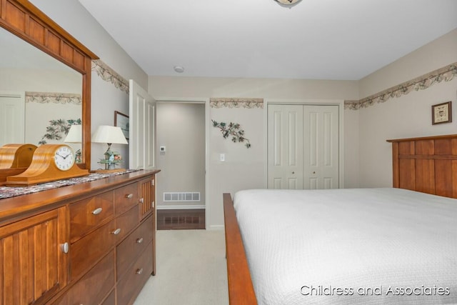 bedroom featuring a closet and visible vents