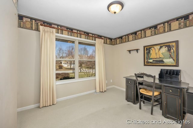 office area featuring light colored carpet and baseboards