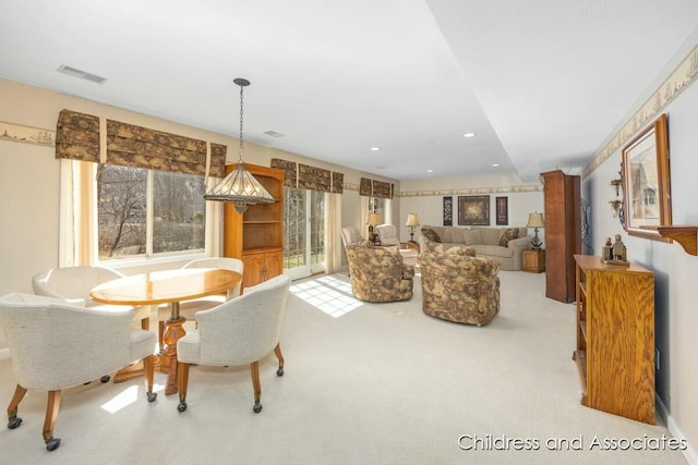 carpeted dining space with recessed lighting and visible vents