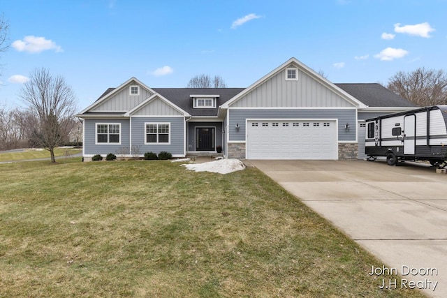 craftsman house with a front lawn, stone siding, board and batten siding, concrete driveway, and a garage