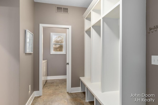 mudroom featuring baseboards and visible vents