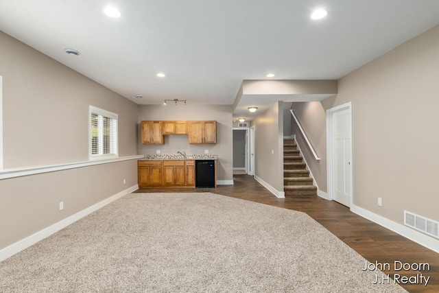 kitchen featuring recessed lighting, visible vents, baseboards, and dark wood-style floors