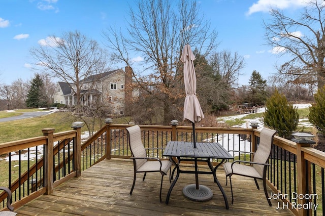 wooden deck with outdoor dining space