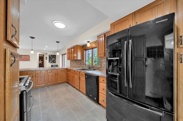 kitchen with light tile patterned flooring, a sink, black appliances, pendant lighting, and tasteful backsplash