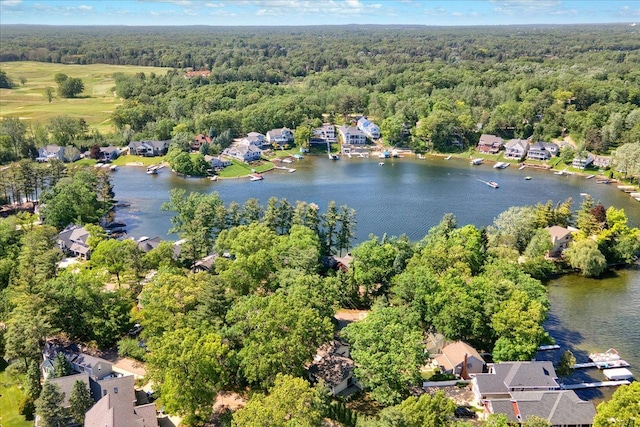 bird's eye view featuring a residential view, a forest view, and a water view