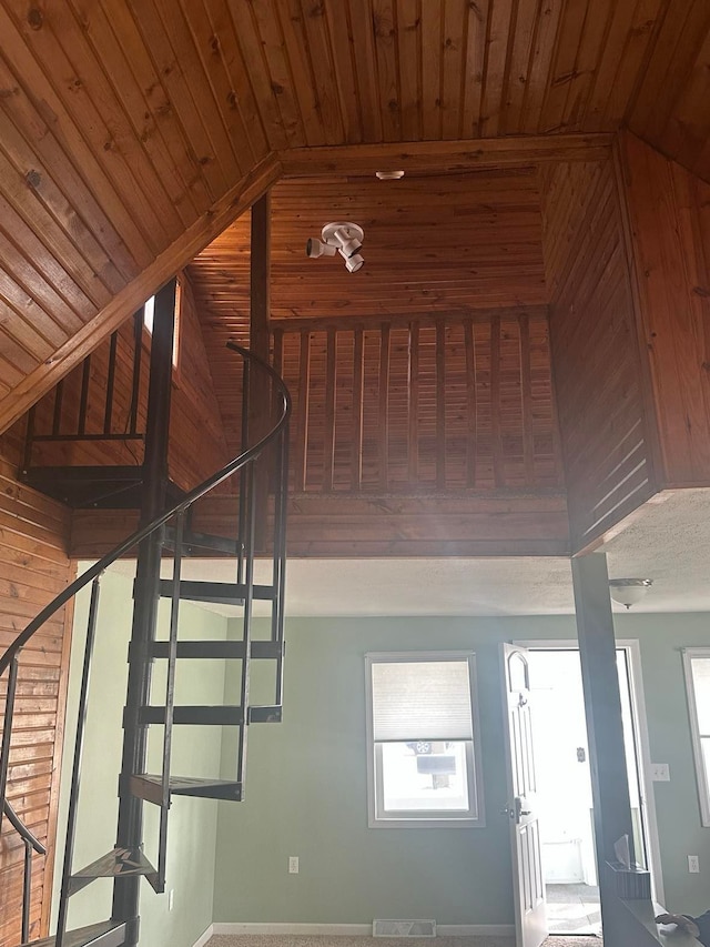 stairs with visible vents and wood ceiling