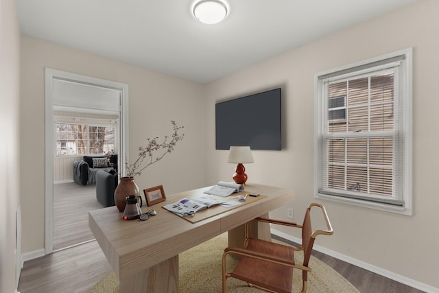 office area featuring wood finished floors and baseboards