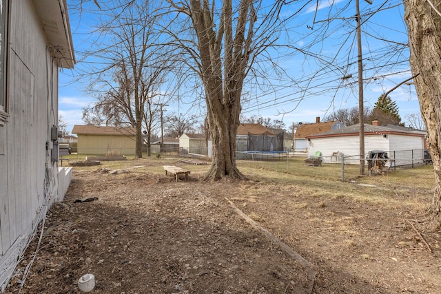 view of yard featuring a fenced backyard and a trampoline