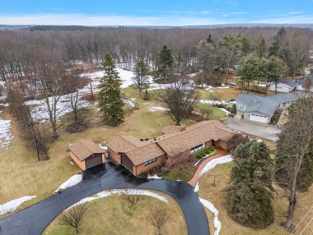 birds eye view of property with a forest view