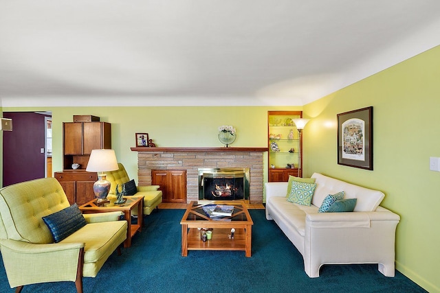 carpeted living room with baseboards and a fireplace with flush hearth