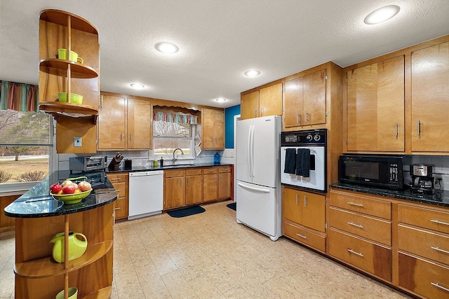 kitchen featuring brown cabinets, open shelves, a sink, white appliances, and light floors