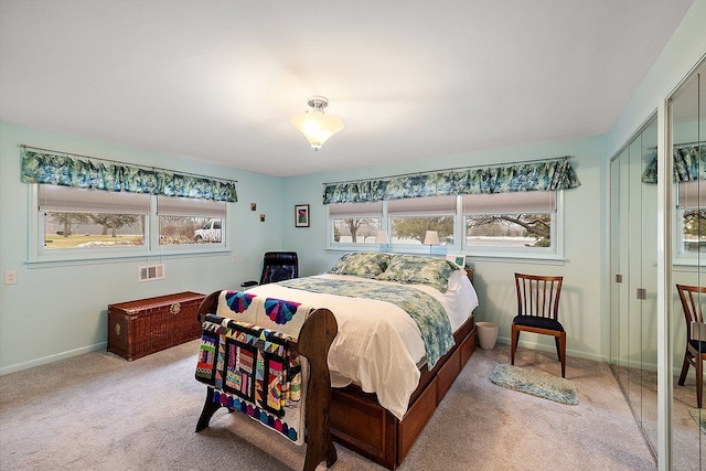 bedroom featuring baseboards and carpet floors